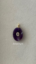Amethyst pendant on a gray background with 'Amethyst' text.