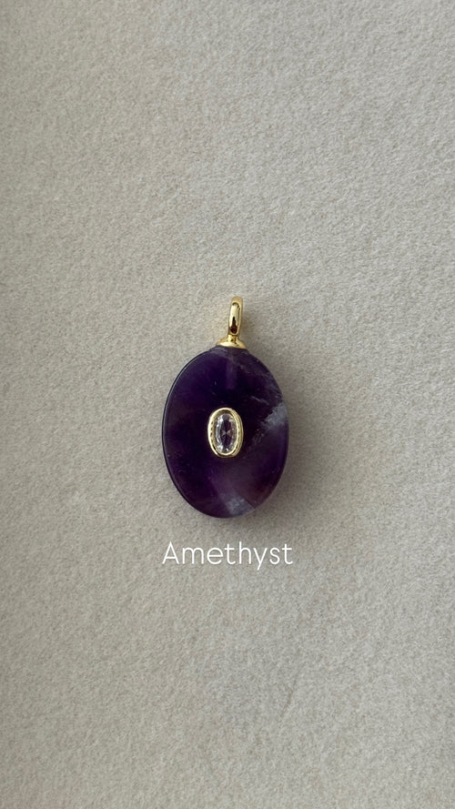 Amethyst pendant on a gray background with 'Amethyst' text.